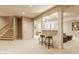 A finished basement with a bar, stools, and a seating area with a staircase at 269 Manchester Ct, Noblesville, IN 46060