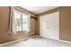 A bedroom features neutral walls and carpet, a closet, and a window with backyard views at 269 Manchester Ct, Noblesville, IN 46060