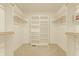 Walk-in closet with built-in shelving and hanging rods, providing ample storage space at 269 Manchester Ct, Noblesville, IN 46060