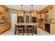 Well-equipped kitchen with custom wood cabinets, center island, and modern appliances at 269 Manchester Ct, Noblesville, IN 46060