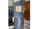 Vintage bathroom with blue tile and mirrored sliding glass doors in shower at 302 E Main St, Greenfield, IN 46140