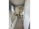 Bright bathroom with unique flooring, built-in storage, and a window at 302 E Main St, Greenfield, IN 46140
