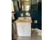 Bathroom with white vanity, blue tile backsplash, and mosaic tile flooring at 302 E Main St, Greenfield, IN 46140