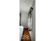 A cozy bedroom featuring a twin bed and natural light streaming through the windows with black and white curtains at 302 E Main St, Greenfield, IN 46140