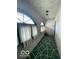 Hallway with arch windows and a distinctive patterned floor at 302 E Main St, Greenfield, IN 46140