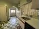 Roomy vintage-style kitchen with tiled archways and natural light at 302 E Main St, Greenfield, IN 46140
