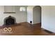 Living room with hardwood floors, fireplace, and neutral paint at 302 E Main St, Greenfield, IN 46140