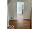 A cozy living room featuring hardwood floors and an arched entryway at 302 E Main St, Greenfield, IN 46140