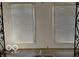 Image of an indoor sunroom with two large windows with blinds and tiled floors at 302 E Main St, Greenfield, IN 46140