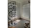 Sunroom featuring two windows, tiled floors, and metal fence at 302 E Main St, Greenfield, IN 46140