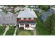 A neat two-story home with a well-maintained lawn and a gray roof at 319 N Ridgeview Dr, Indianapolis, IN 46219