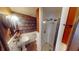 Unique bathroom with vanity sink and shower, and walls decorated with wallpaper made of vintage books at 319 N Ridgeview Dr, Indianapolis, IN 46219