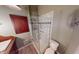 Well-lit bathroom featuring a glass-enclosed shower and classic fixtures at 319 N Ridgeview Dr, Indianapolis, IN 46219