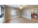 Bright bedroom featuring a window with blinds and tan carpet at 319 N Ridgeview Dr, Indianapolis, IN 46219