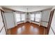 Charming dining area features wooden floors, neutral walls, bright windows, and decorative wall trim at 319 N Ridgeview Dr, Indianapolis, IN 46219
