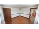 Classic dining room features warm wood floors, decorative wall trim, and a well-lit window at 319 N Ridgeview Dr, Indianapolis, IN 46219
