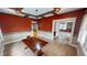 Spacious dining room featuring coffered ceilings, a chandelier, and hardwood floors at 319 N Ridgeview Dr, Indianapolis, IN 46219
