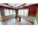 Charming dining room featuring hardwood floors, a classic chandelier, and abundant natural light at 319 N Ridgeview Dr, Indianapolis, IN 46219
