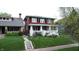 Charming two-story home with a welcoming front porch and lush, green lawn at 319 N Ridgeview Dr, Indianapolis, IN 46219