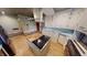 Bright kitchen with white cabinets, stainless appliances, center island, and decorative tin tile ceiling at 319 N Ridgeview Dr, Indianapolis, IN 46219