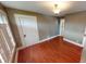 Cozy living room featuring warm wood floors and neutral-colored walls at 319 N Ridgeview Dr, Indianapolis, IN 46219