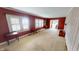 Cozy living room with paneled walls, large windows, and classic furnishings, perfect for relaxing at 319 N Ridgeview Dr, Indianapolis, IN 46219