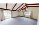 Spacious living room boasting high ceilings with wood beams and natural light at 319 N Ridgeview Dr, Indianapolis, IN 46219