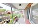 Covered porch overlooking a spacious backyard with a bench and well-kept lawn at 319 N Ridgeview Dr, Indianapolis, IN 46219