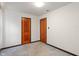Bedroom featuring carpeted flooring and simple design with paneled doors at 327 S Biltmore Ave, Indianapolis, IN 46241