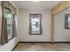 Light-filled dining area with tile flooring and charming window treatments at 327 S Biltmore Ave, Indianapolis, IN 46241