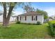 Attractive one-story home with tidy lawn and side garage access, and an old shade tree at 327 S Biltmore Ave, Indianapolis, IN 46241