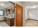Classic kitchen design with wood cabinets and an adjacent room, creating an open feel at 327 S Biltmore Ave, Indianapolis, IN 46241