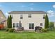 Large backyard with a patio, complete with an outdoor dining set, grill, and well-kept lawn at 3430 Burlingame Blvd, Westfield, IN 46074