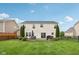 A spacious backyard featuring a brick patio with a dining set, ideal for enjoying outdoor meals at 3430 Burlingame Blvd, Westfield, IN 46074