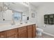 Bathroom with double vanity, a large mirror, wood cabinets and a separate room for the shower at 3430 Burlingame Blvd, Westfield, IN 46074
