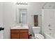 Cozy bathroom with wood vanity, toilet, and shower/tub combo at 3430 Burlingame Blvd, Westfield, IN 46074