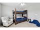 Bedroom showcasing a wooden bunk bed, a white chair, and neutral carpet at 3430 Burlingame Blvd, Westfield, IN 46074