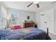 Bedroom with a colorful bed, dresser, and ceiling fan at 3430 Burlingame Blvd, Westfield, IN 46074