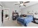 Bedroom with a ceiling fan, blue bed, and desk at 3430 Burlingame Blvd, Westfield, IN 46074