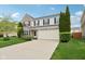Lovely exterior shot of a home with mature trees and a well-kept lawn at 3430 Burlingame Blvd, Westfield, IN 46074