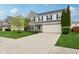 Attractive home with a two-car garage, green lawn, and mature trees at 3430 Burlingame Blvd, Westfield, IN 46074