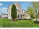 Side view of a two-story home with a green lawn and manicured landscaping at 3430 Burlingame Blvd, Westfield, IN 46074