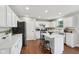 Modern kitchen with white cabinets, stainless appliances, and kitchen island at 3430 Burlingame Blvd, Westfield, IN 46074