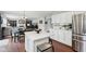 Updated kitchen with white countertops, cabinets, and island with seating at 3430 Burlingame Blvd, Westfield, IN 46074