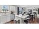 Open kitchen and dining area with white cabinets and modern appliances at 3430 Burlingame Blvd, Westfield, IN 46074