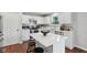 Bright kitchen featuring white cabinets, stainless steel appliances, and a center island at 3430 Burlingame Blvd, Westfield, IN 46074