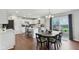 Bright kitchen with white cabinetry, stainless steel appliances, and island seating at 3430 Burlingame Blvd, Westfield, IN 46074
