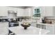 Bright kitchen featuring white cabinets, stainless steel appliances, and a center island at 3430 Burlingame Blvd, Westfield, IN 46074