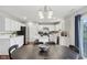 Modern kitchen with white cabinets, island, and connecting dining area at 3430 Burlingame Blvd, Westfield, IN 46074
