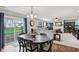 Open floor plan connecting dining area and living room with fireplace at 3430 Burlingame Blvd, Westfield, IN 46074